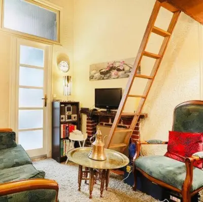 Coin salon dans l'établissement A Cozy Parisian Nest by Notre Dame