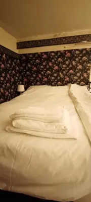 Un ou plusieurs lits dans un hébergement de l'établissement Cozy Home near Notre-Dame