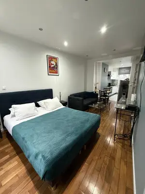 Un ou plusieurs lits dans un hébergement de l'établissement Lea appartement