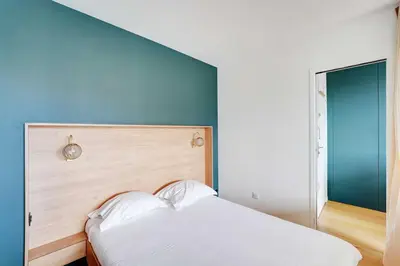Un ou plusieurs lits dans un hébergement de l'établissement Elegant Apartment - 1BR- 2P- Nation