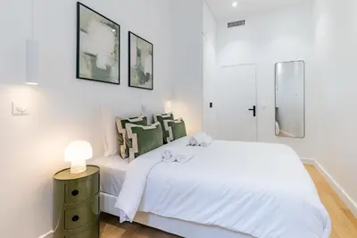 Un ou plusieurs lits dans un hébergement de l'établissement Appartement de prestige climatisé