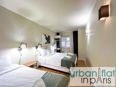 Un ou plusieurs lits dans un hébergement de l'établissement UrbanFlat 132 - Superbe appartement de 4 chambres dans le centre