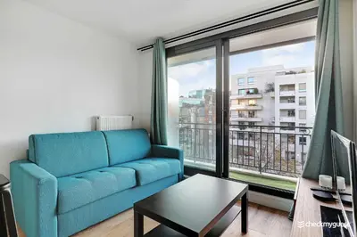 Coin salon dans l'établissement Cozy apartment - 1BR 4P - next to Paris