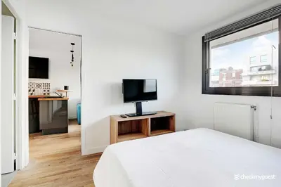 Télévision ou salle de divertissement dans l'établissement Cozy apartment - 1BR 4P - next to Paris