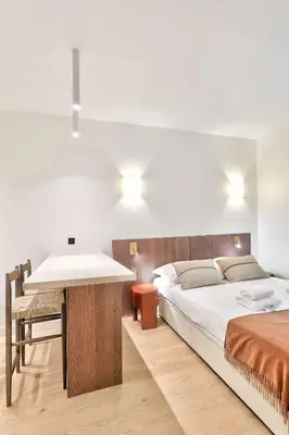 Un ou plusieurs lits dans un hébergement de l'établissement Sublime refurbished studio