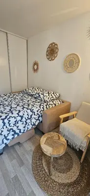 Un ou plusieurs lits dans un hébergement de l'établissement A cozy room