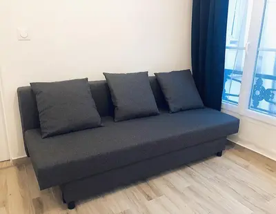 Coin salon dans l'établissement Superbe appartement flambant neuf au centre de Paris