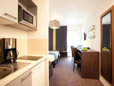Cuisine ou kitchenette dans l'établissement Lagrange Apart’Hotel Paris-Boulogne