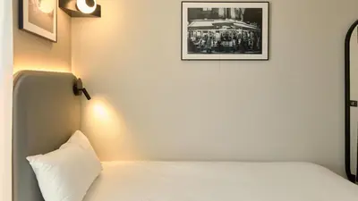Un ou plusieurs lits dans un hébergement de l'établissement Campanile PRIME - Paris 15 Tour Eiffel