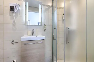 Salle de bains dans l'établissement Hotel De Paris