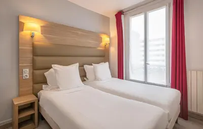Un ou plusieurs lits dans un hébergement de l'établissement Hotel Luxor