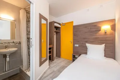 Un ou plusieurs lits dans un hébergement de l'établissement Hotel Luxor