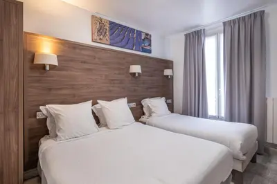 Un ou plusieurs lits dans un hébergement de l'établissement Hotel Luxor