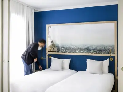 Un ou plusieurs lits dans un hébergement de l'établissement Aparthotel Adagio Paris Porte de Versailles