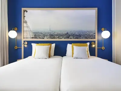 Un ou plusieurs lits dans un hébergement de l'établissement Aparthotel Adagio Paris Porte de Versailles