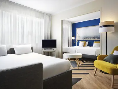 Un ou plusieurs lits dans un hébergement de l'établissement Aparthotel Adagio Paris Porte de Versailles