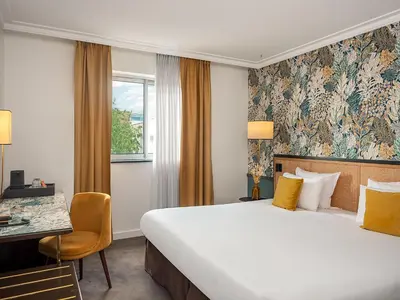 Un ou plusieurs lits dans un hébergement de l'établissement Hôtel Mercure Paris Boulogne Pont de Saint Cloud