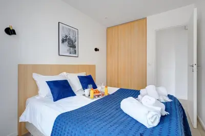 Un ou plusieurs lits dans un hébergement de l'établissement 161 Suite Raphael - Superbe Appartement à Paris