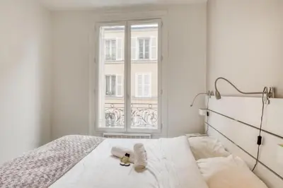 Un ou plusieurs lits dans un hébergement de l'établissement Charming Apartment close to Gare de Lyon