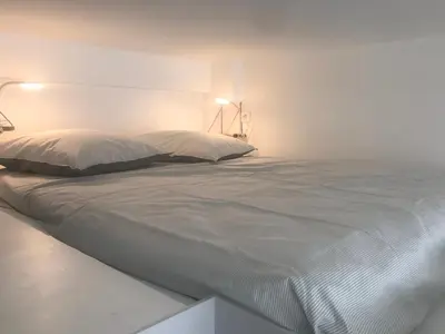 Un ou plusieurs lits dans un hébergement de l'établissement Bel appartement avec Mezzanine pour 4 Personnes au Centre de Paris