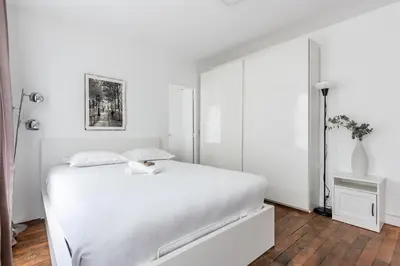 Un ou plusieurs lits dans un hébergement de l'établissement Appartement Magenta Quest